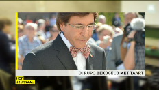 Di Rupo met taart bekogeld